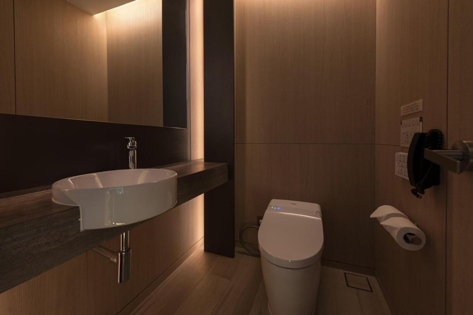 Mu Jiaoxi Hotel Exteriör bild A modern bathroom