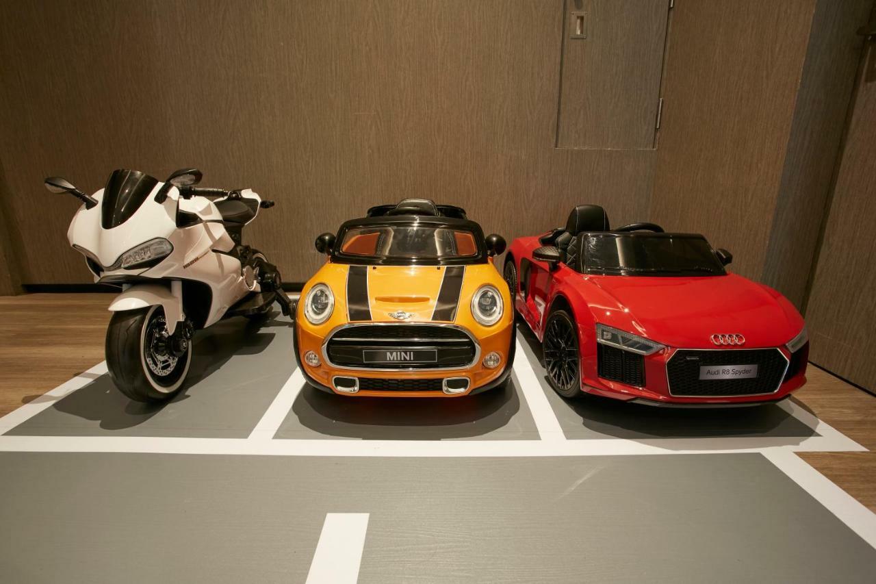 Mu Jiaoxi Hotel Exteriör bild Children's electric cars and motorcycle